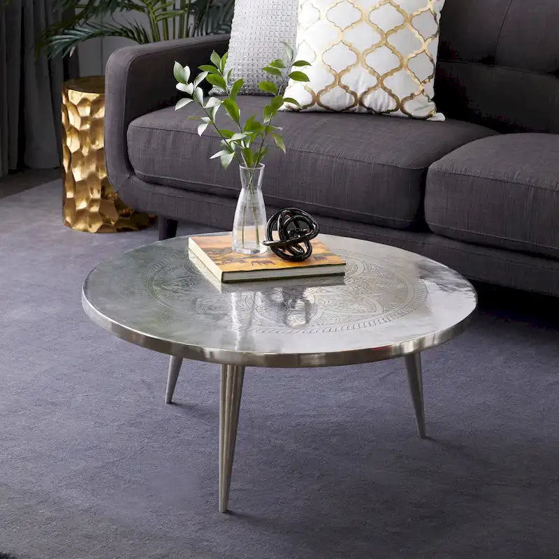 Round Silver Aluminum Coffee Table with Floral Engraving and Tripod Legs, 35x16 Inch
